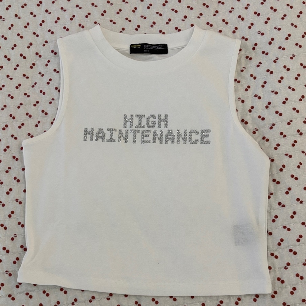 Finesse White Sleeveless Top with Silver Text
Never worn